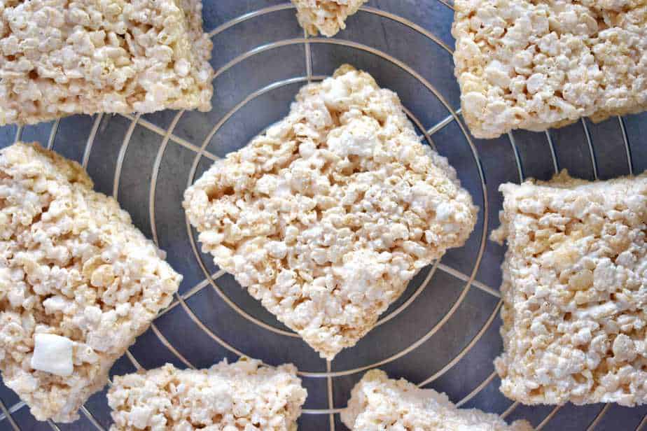 rice krispie treats spread out on cooling rack