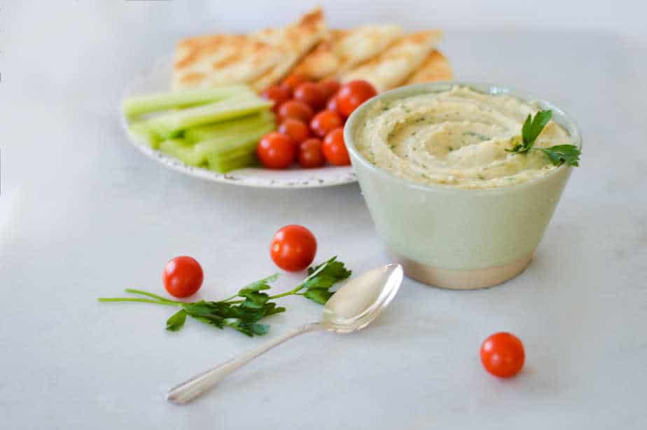 white bean hummus with pita and vegetables.