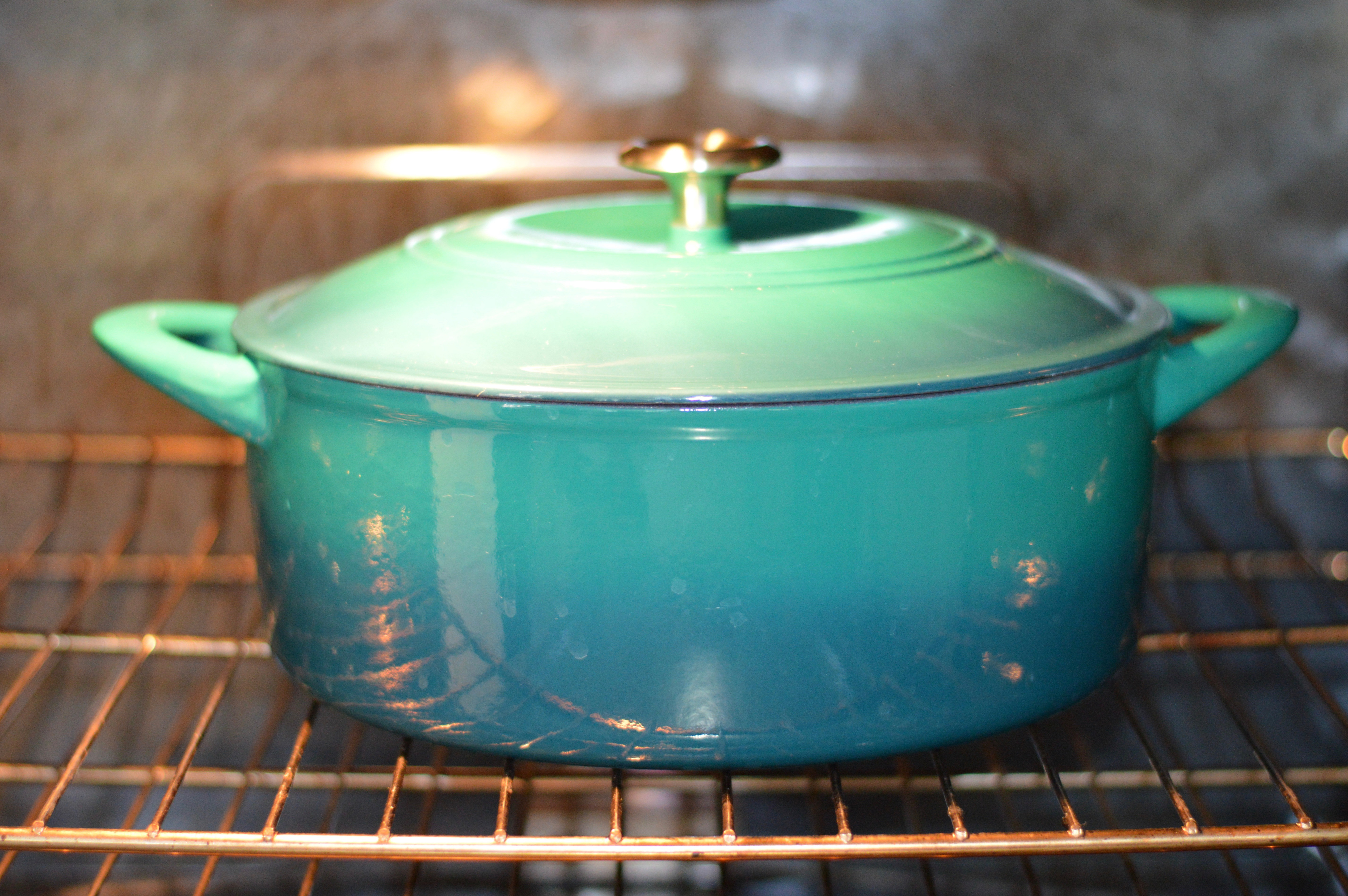 blue dutch oven baking in oven