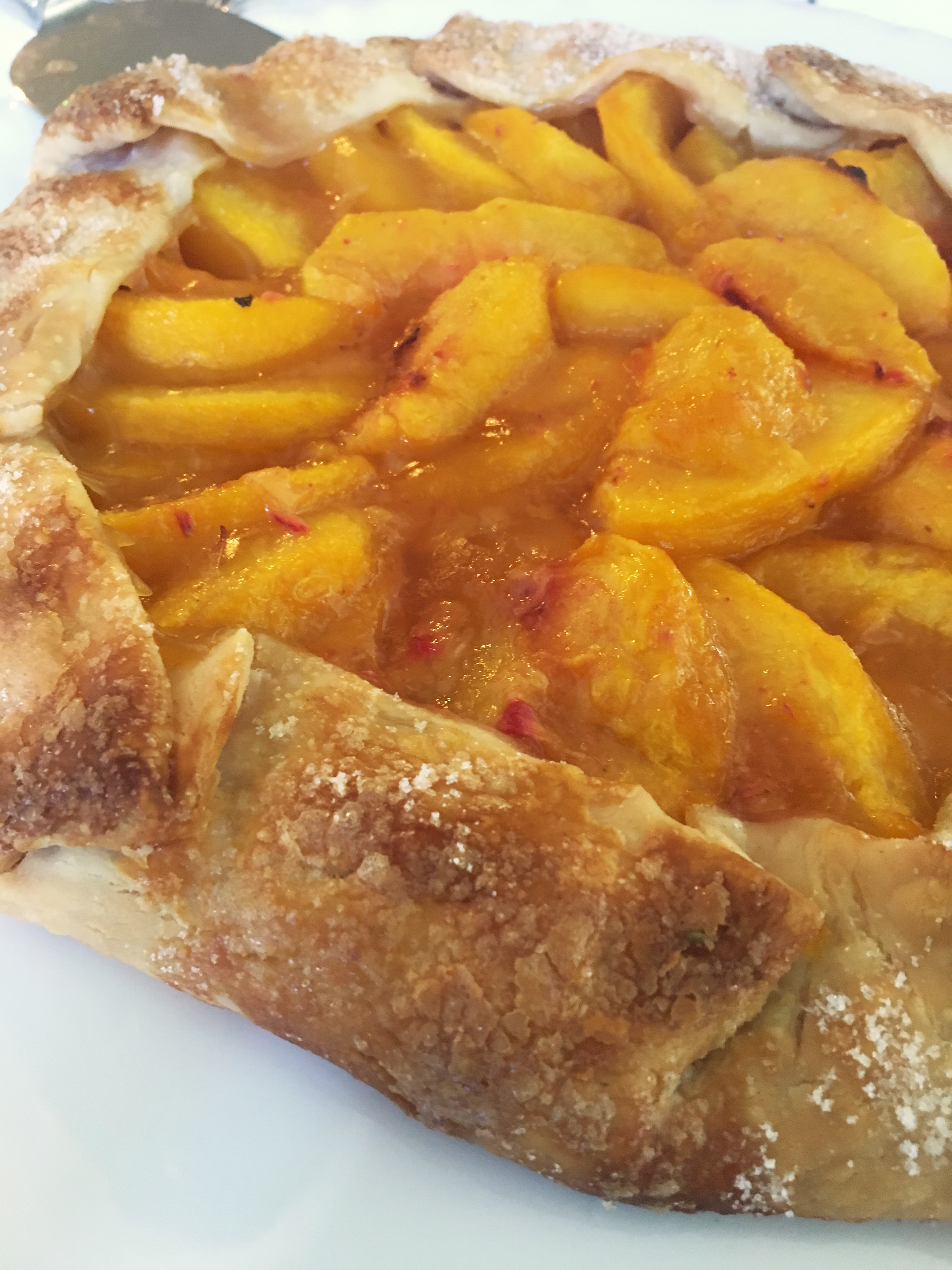 baked fresh peach galette fresh from the oven