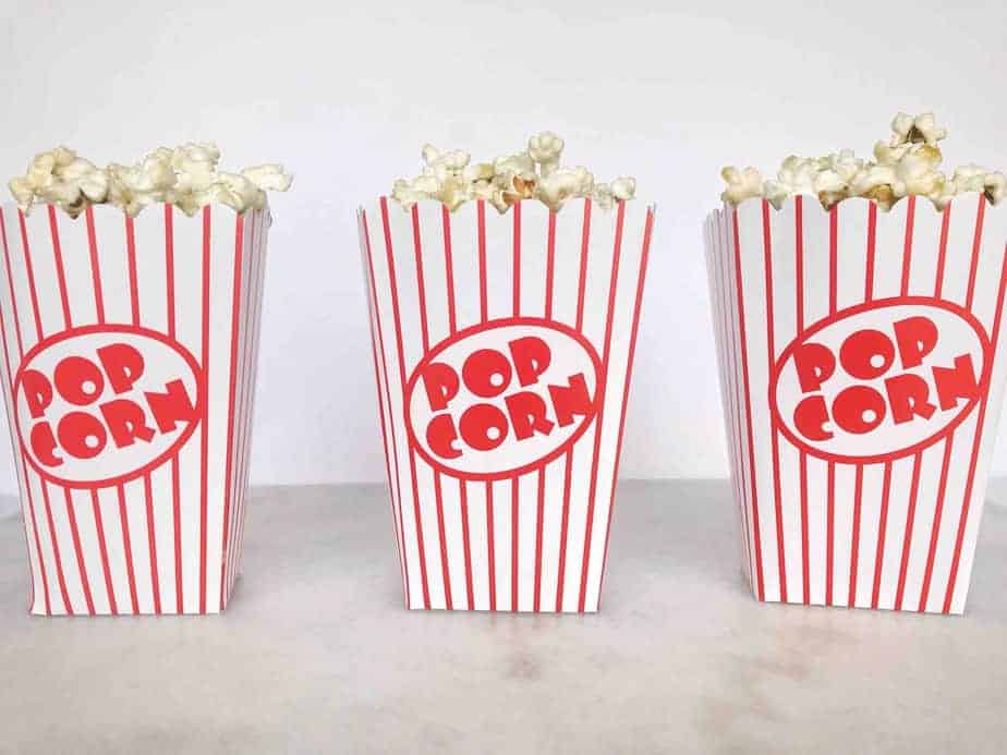 three popcorn buckets lined up in a row