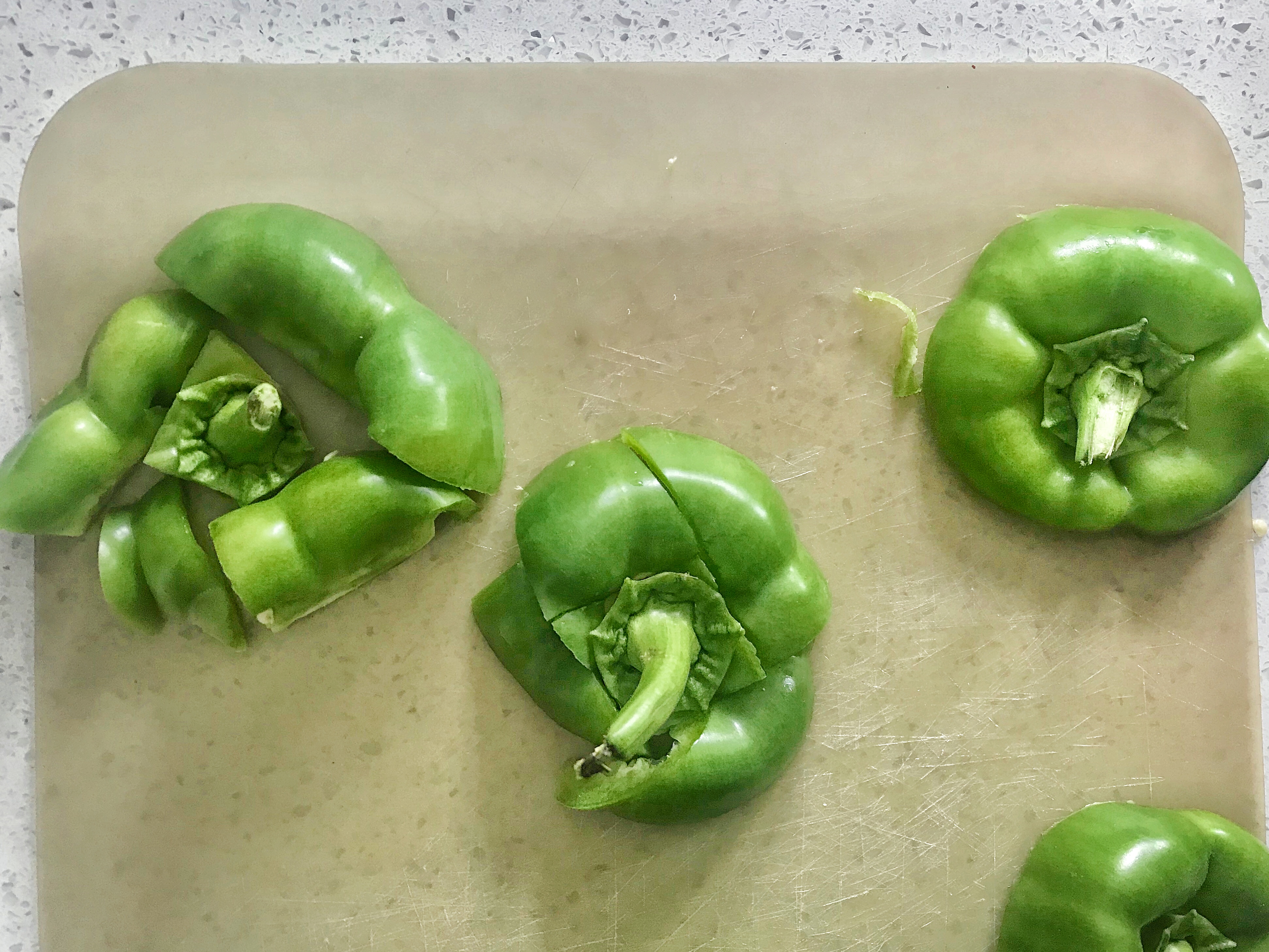 tops of green bell peppers cut