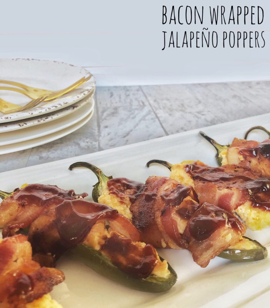 Jalapenos cut in half and filled with cheese and wrapped with bacon then baked