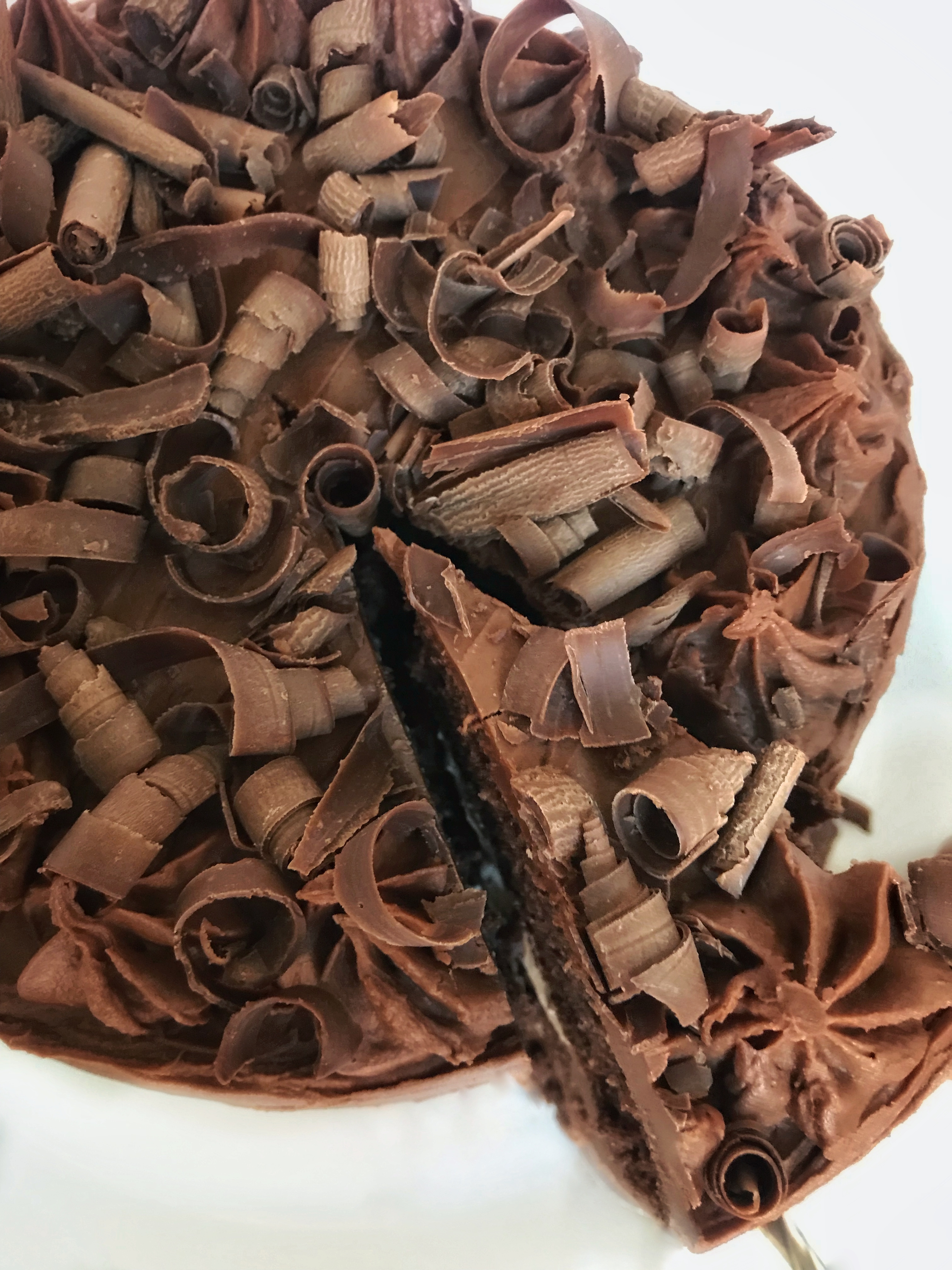 top of chocolate cake covered with chocolate curls