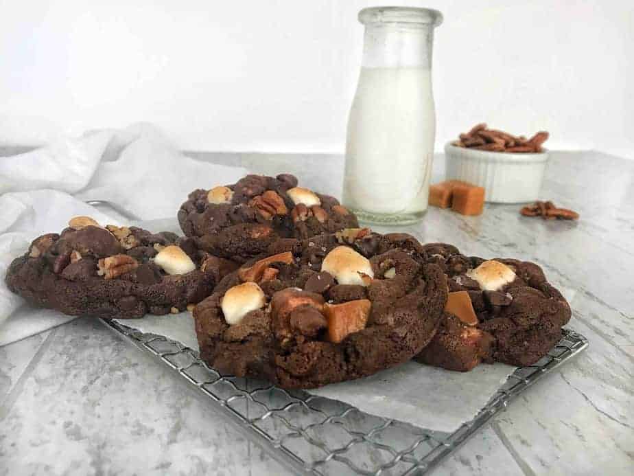 rocky road cookies on cooling rack with milk bottle