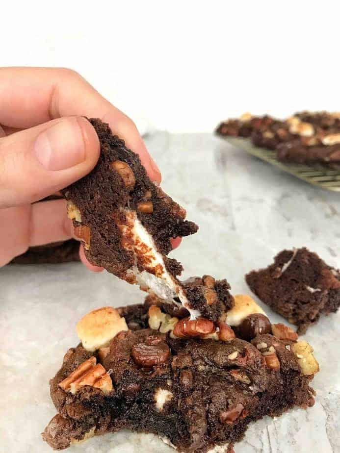 gooey marshmallow stretching on rocky road cookie