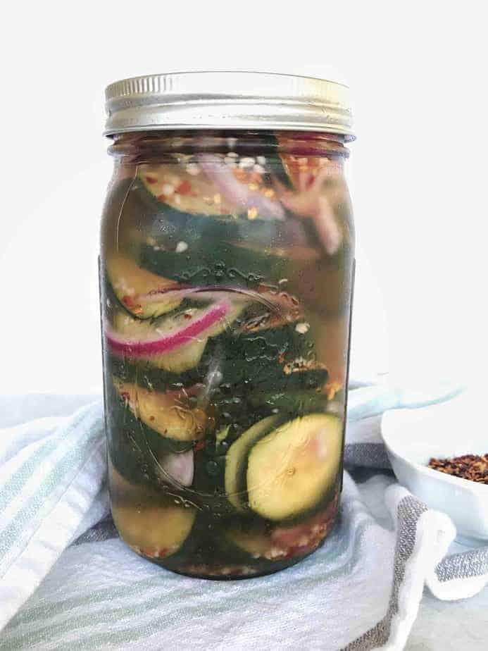 jar with lid on with pickles and red onions inside