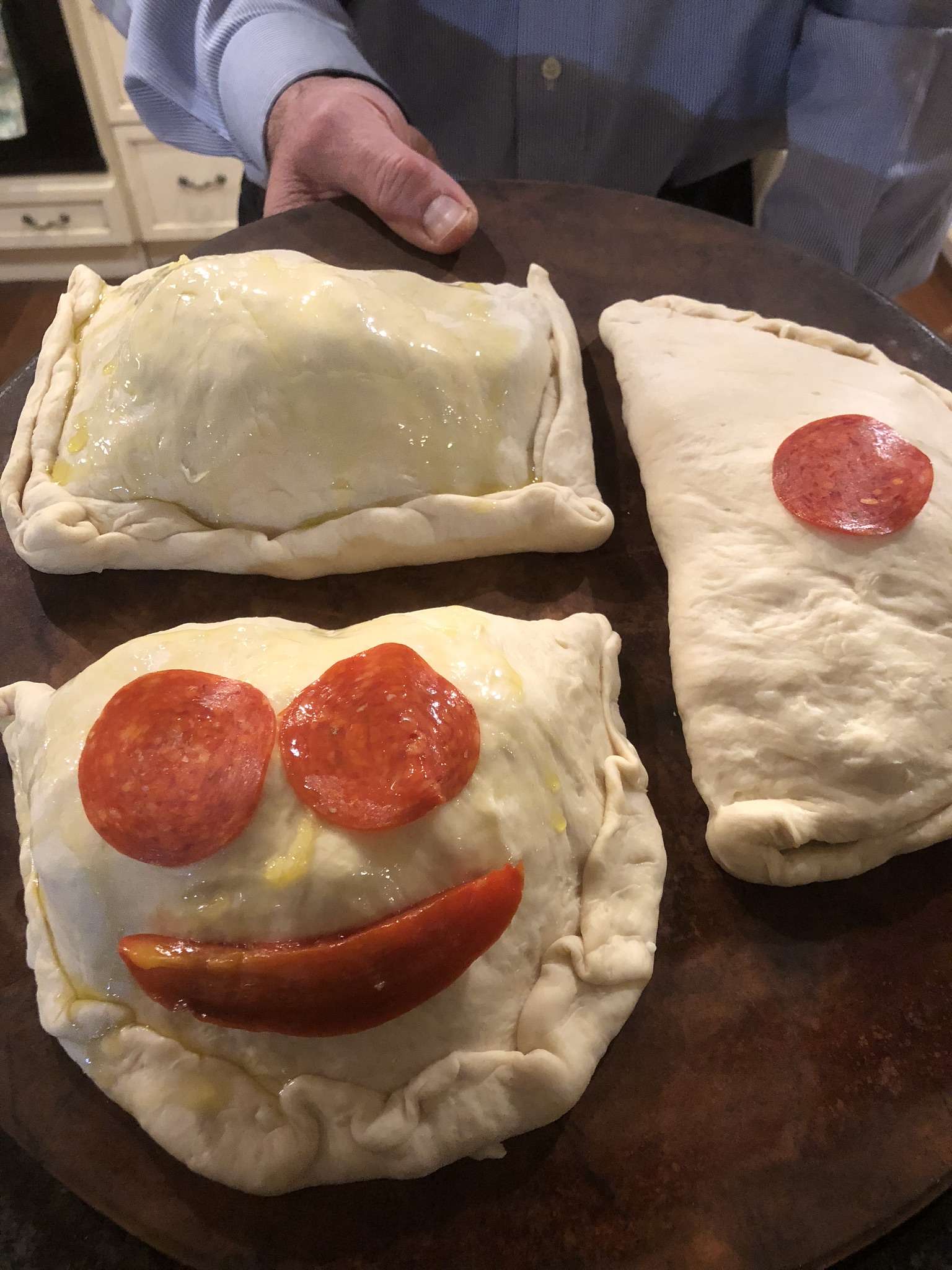 Homemade calzone stuffed with Mozzarella and other fillings 