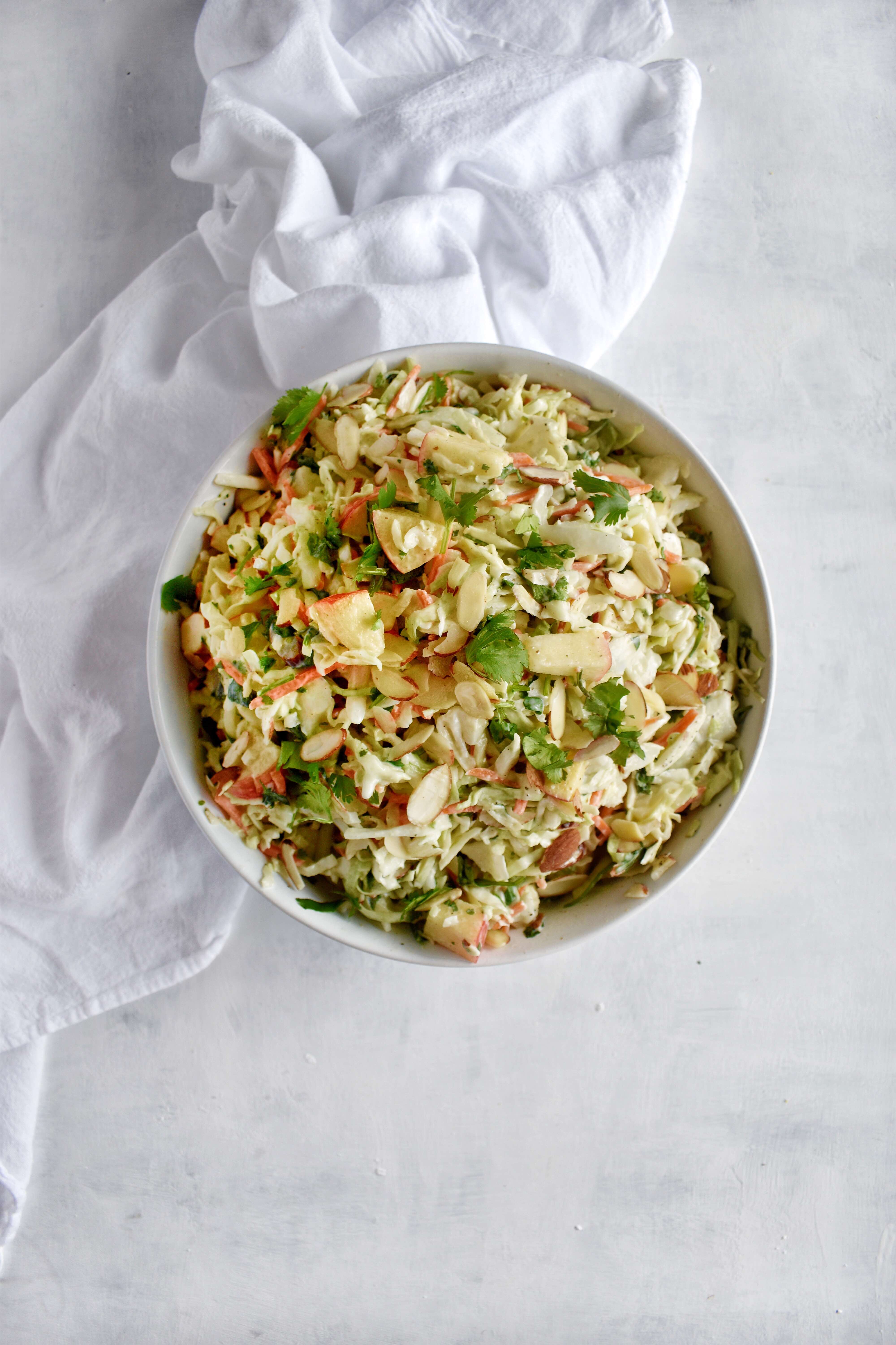apple cilantro lime coleslaw in a bowl