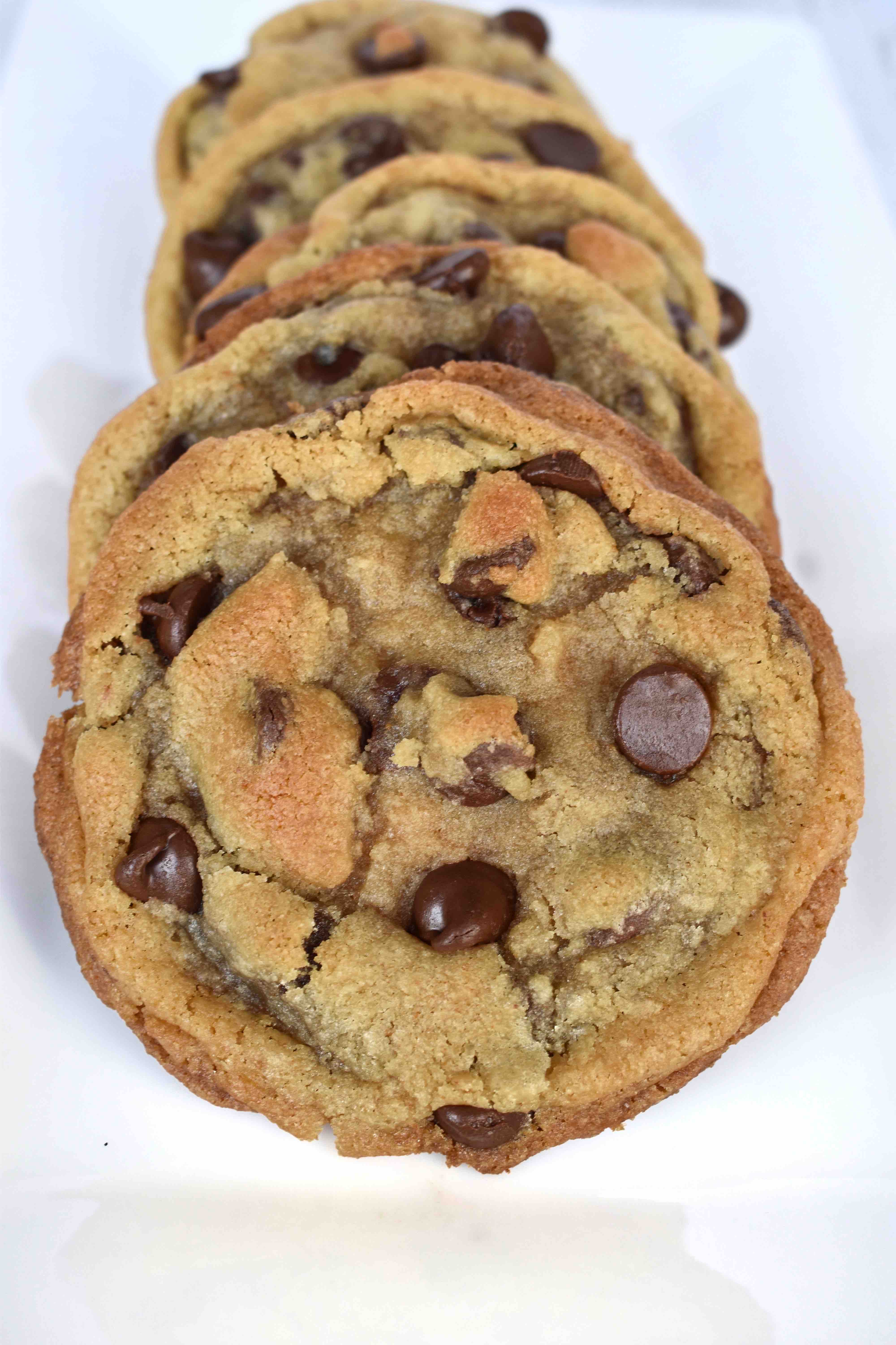 stack of chocolate chip cookies on white platter