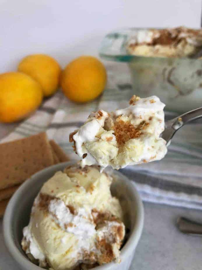 spoon holding up a spoonful of lemon meringue pie ice cream