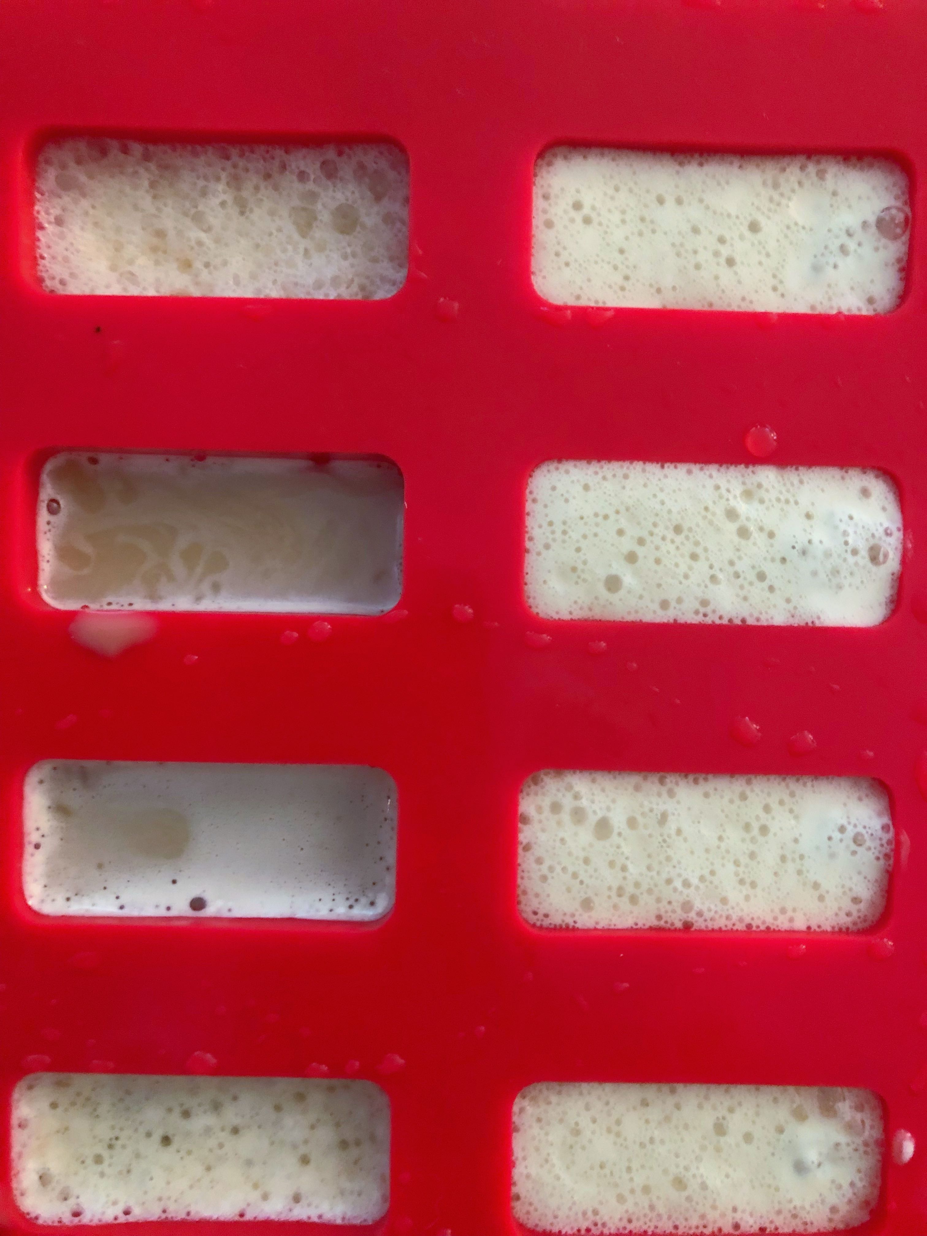 popsicle mold filled with rootbeer float for popsicles
