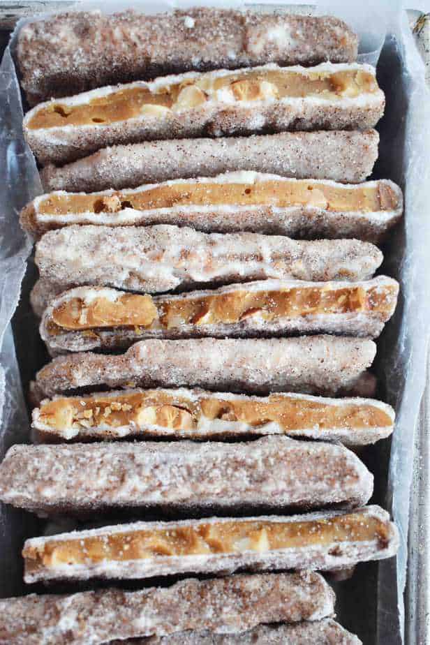 churro toffee stacked in a pan