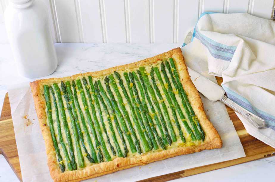 asparagus cheese tart with milk bottle on cutting board