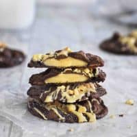 peanut butter cup cookies cut in half stacked on two whole cookies