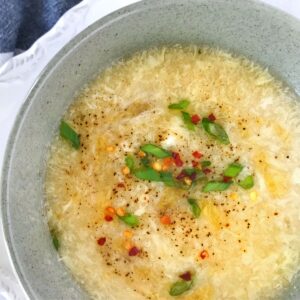 egg drop soup in green bowl