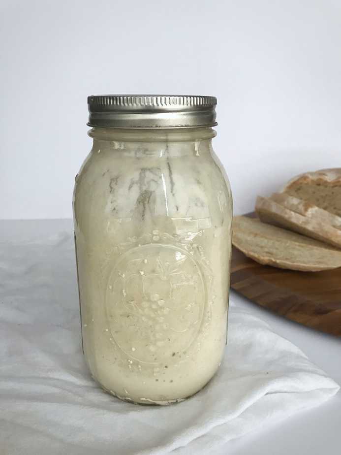 jar of sourdough starter with b
