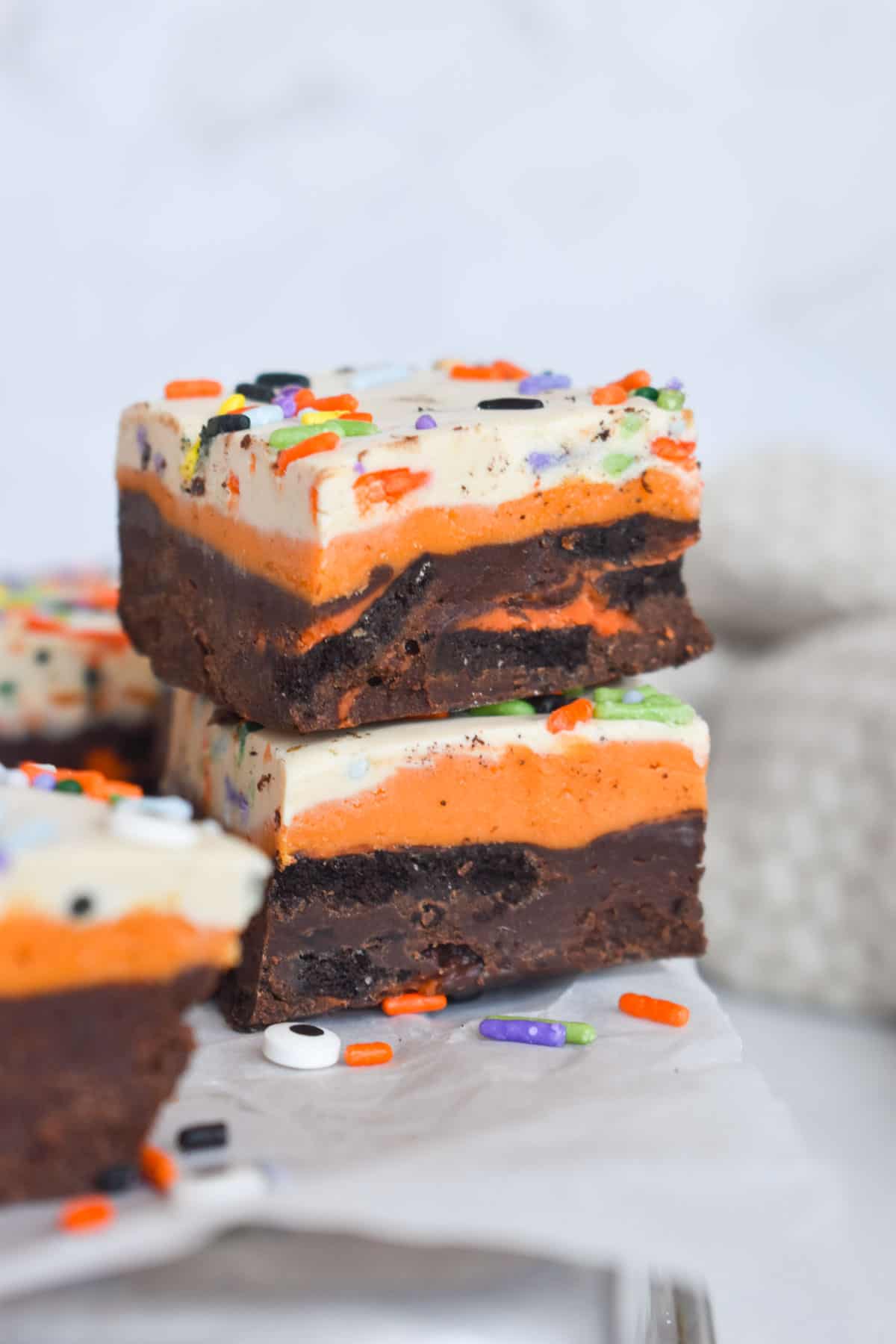 two squares of halloween fudge stacked on top of each other. 