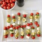 skewers with mozzarella, tortellini pasta, basil and tomatoes