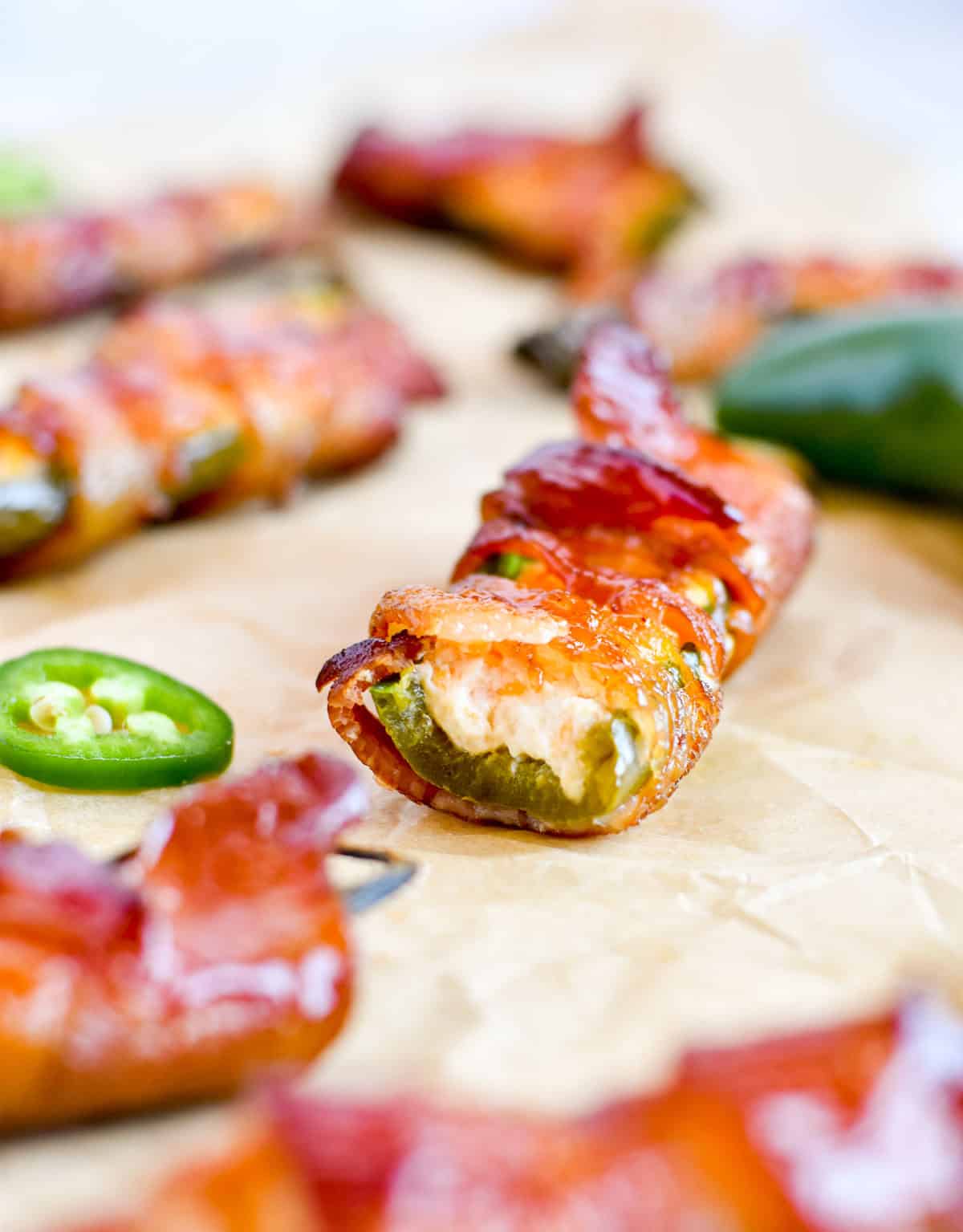bacon wrapped jalapeno popper with bite out of it.