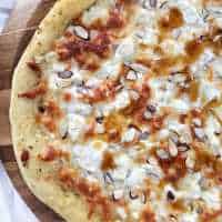three cheese pizza with honey and almonds