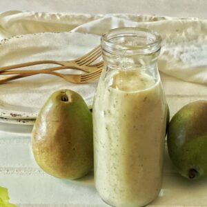 bottle of pear vinaigrette with 2 pears