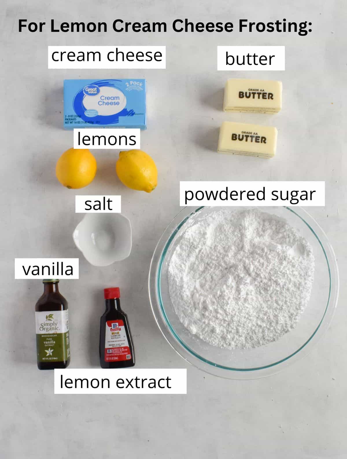 ingredients for lemon cream cheese frosting laid out on white board. 
