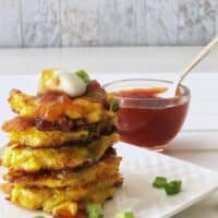 stack of corn fritters with chili peach sauce