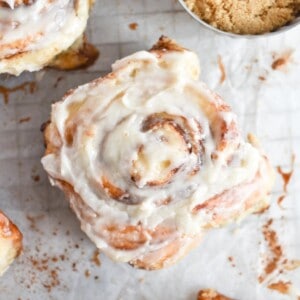 cinnamon roll on white parchment paper.