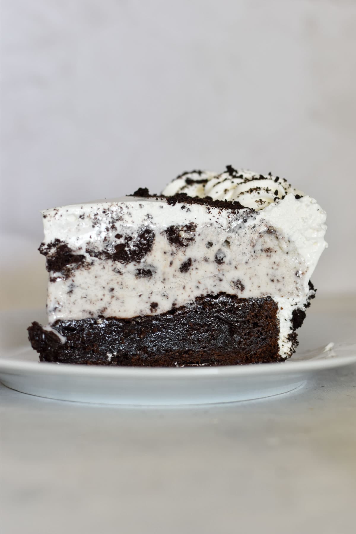 slice of ice cream cake on white plate.