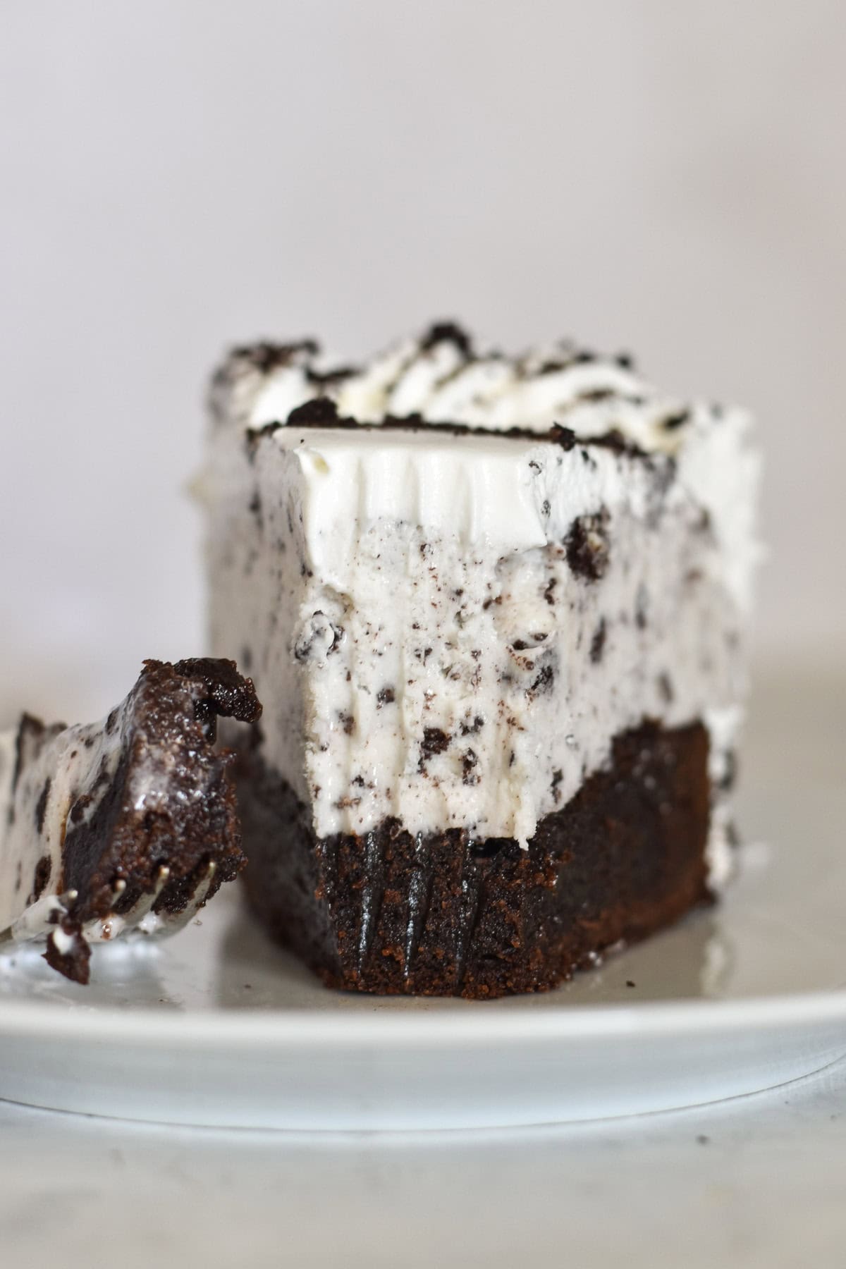 ice cream cake slice with bite out of it.