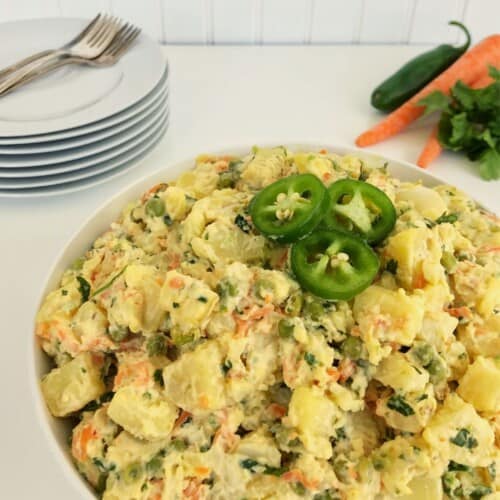 white bowl filled with jalapeno potato salad. featured image