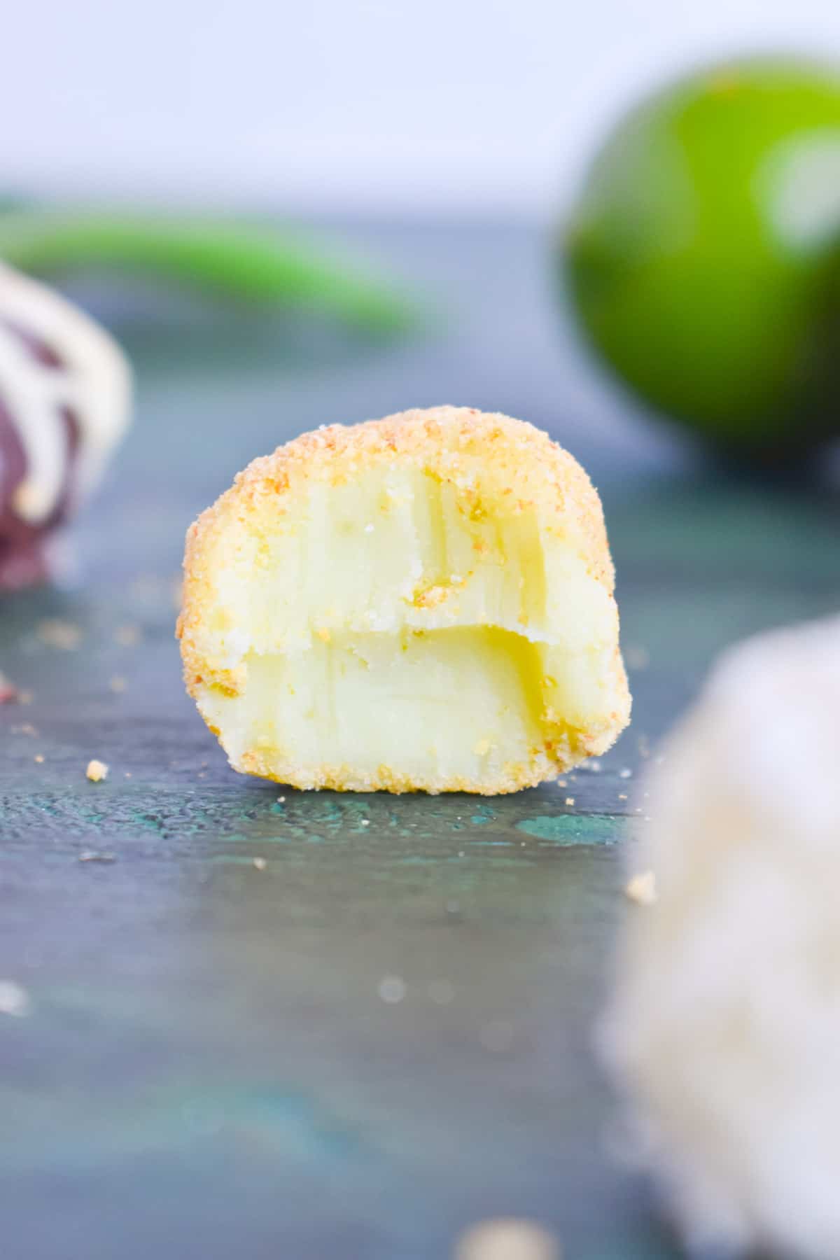key lime truffle with bite out of it. 