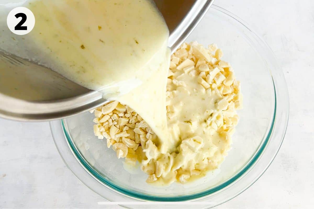cream being poured over chopped white chocolate. 