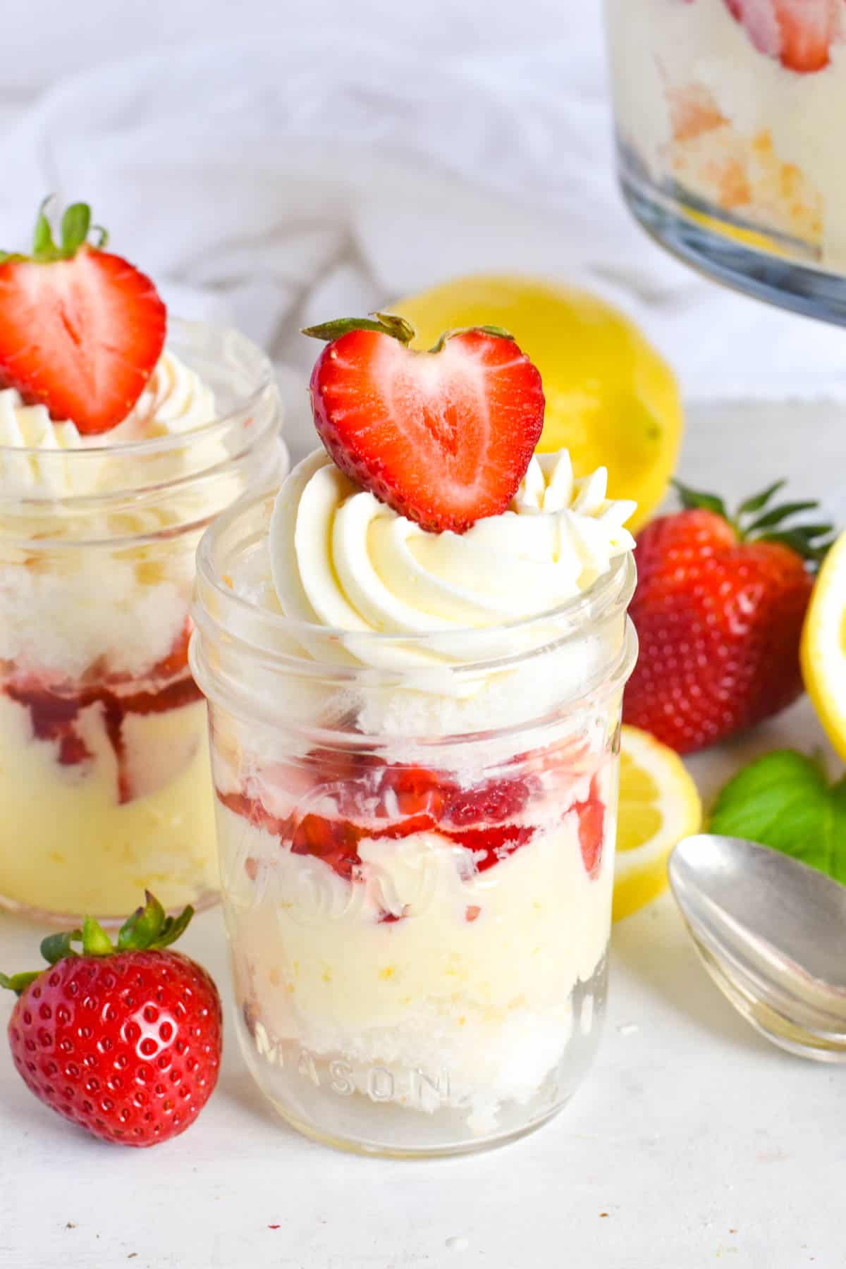strawberry lemon trifle layered in individual jars.