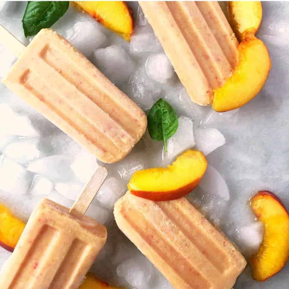 peaches and cream popsicles laying on ice