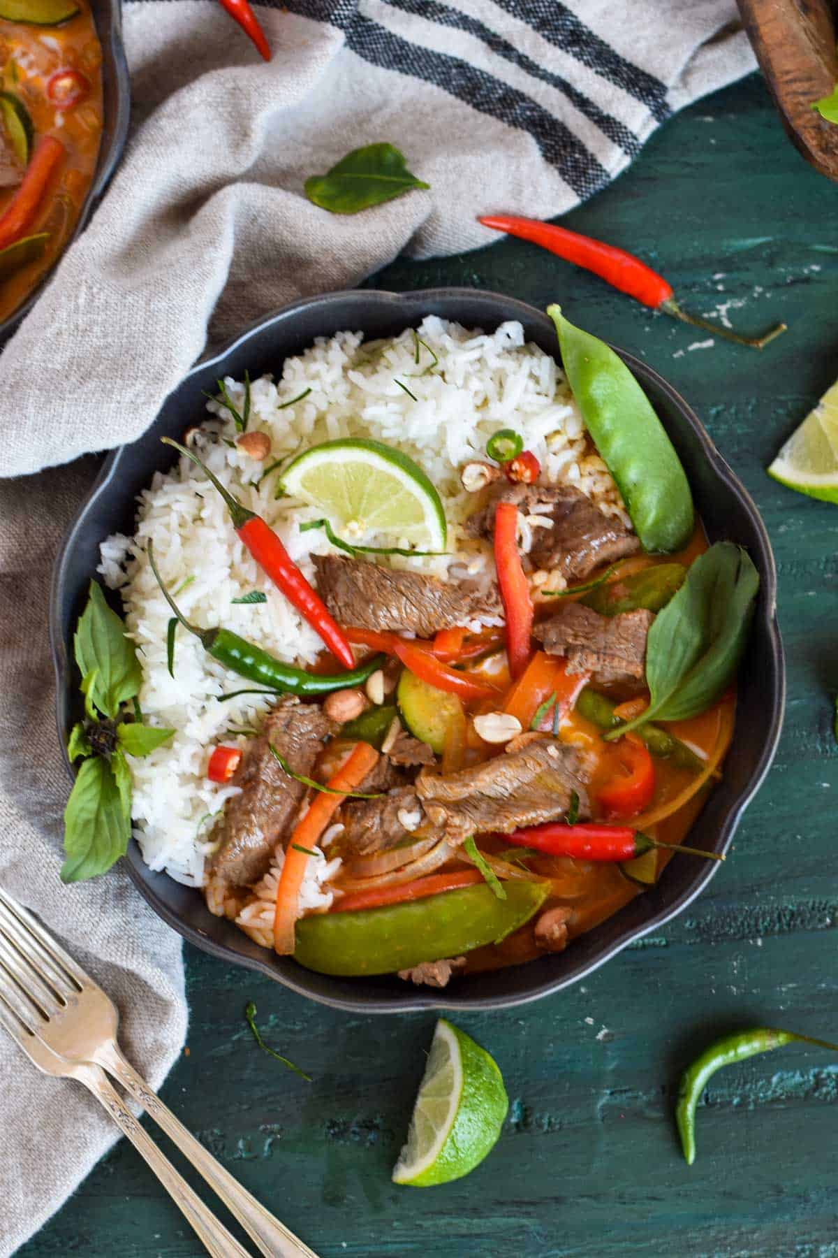 bowl of curry with rice and chilies.