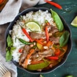 thai beef panang curry in black bowl.