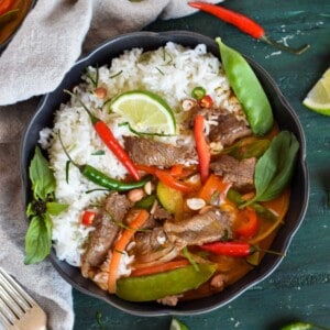 thai beef panang curry in black bowl.