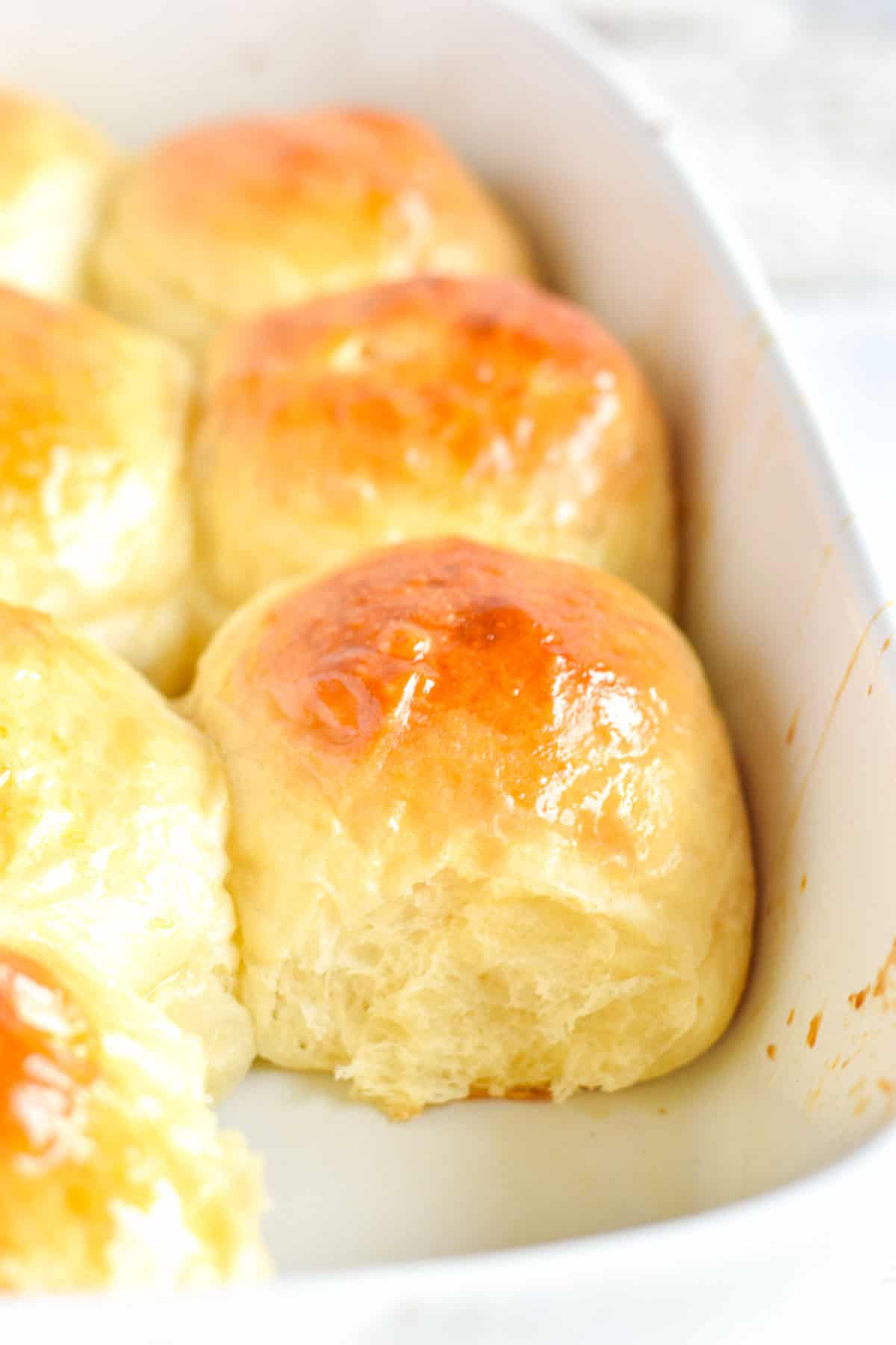 dinner rolls in white stoneware pan.