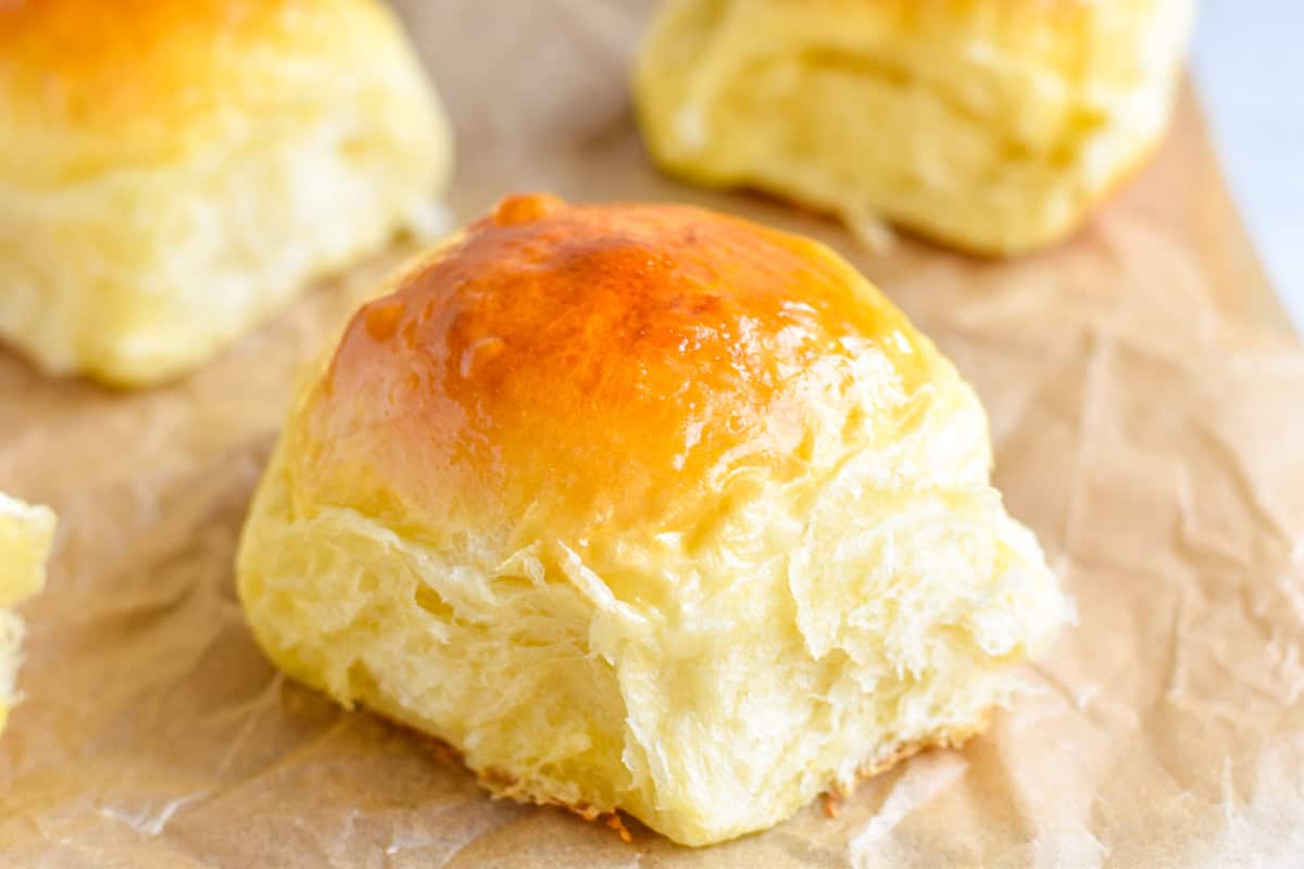 dinner roll on brown parchment paper.
