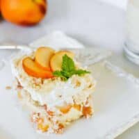Peaches and Cream dessert slice with server.