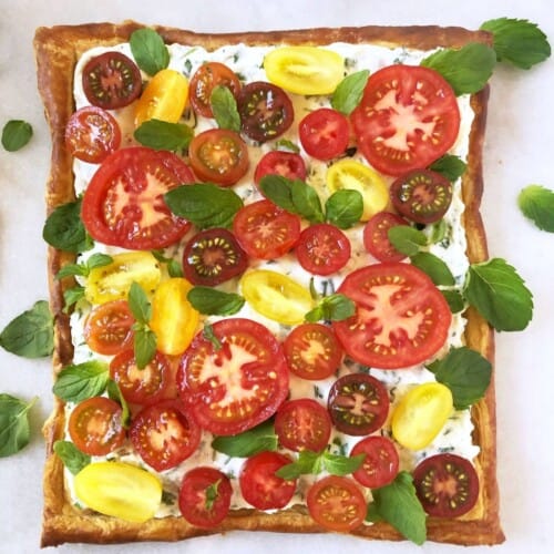 puff pastry appetizer tomato tart with ricotta cheese and herbs for brunch or side dish.