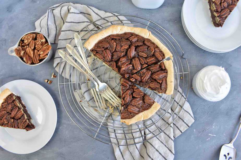 overhead shot showing whole pecan pie and slices on side