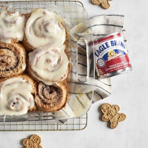 frosted cinnamon rolls in a pan