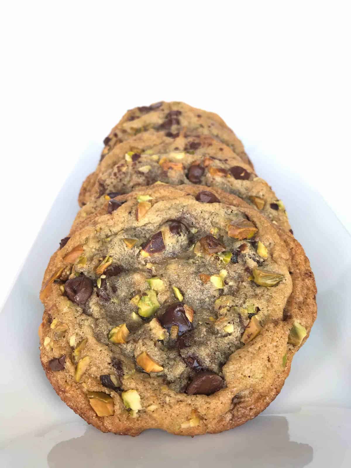 stack of dark chocolate pistachio cookies.