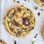 cookie with melty chocolate and pistachios on top.
