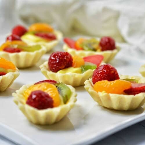 Mini Tart shells filled with fruit and custard.
