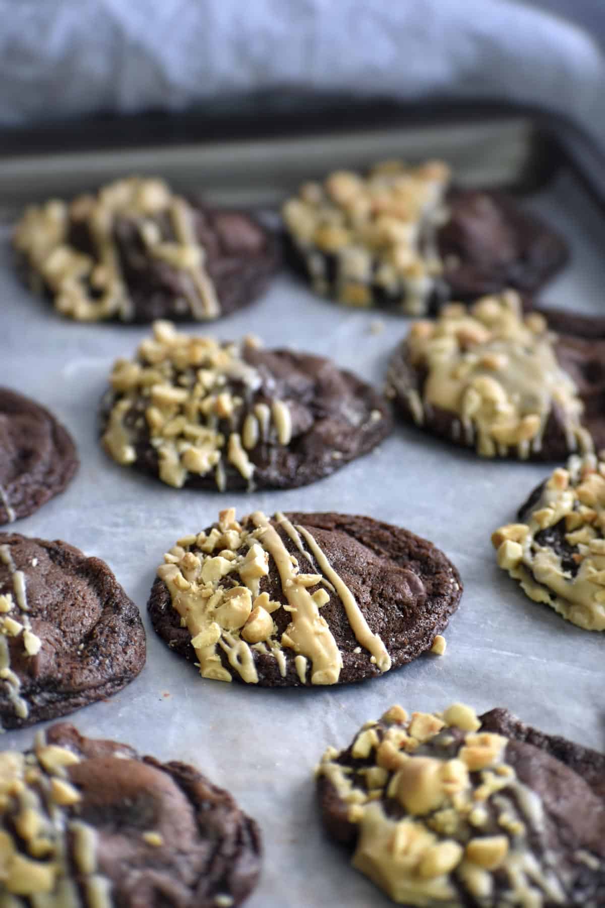chocolate peanut cookies on metal baking sheet.