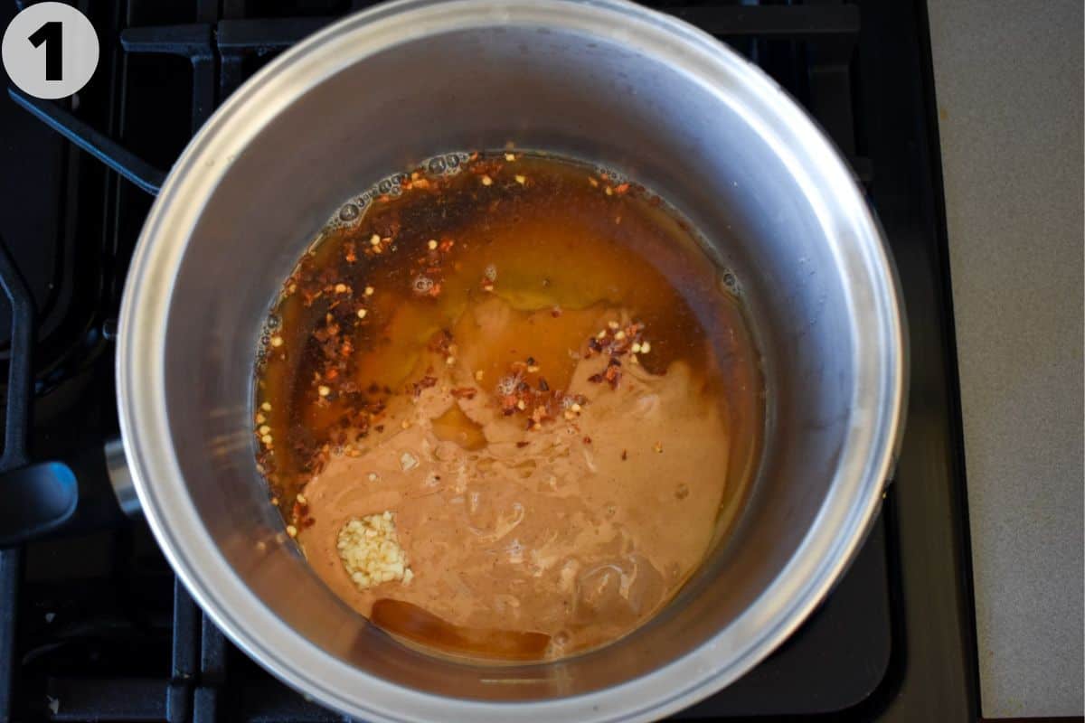 ingredients for peanut sauce in pot. 
